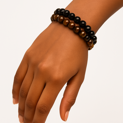 Yellow Tiger Eye energizes your mind, sharpens decisions, and balances emotions, while Obsidian grounds you, blocks negativity, and deepens self-awareness.